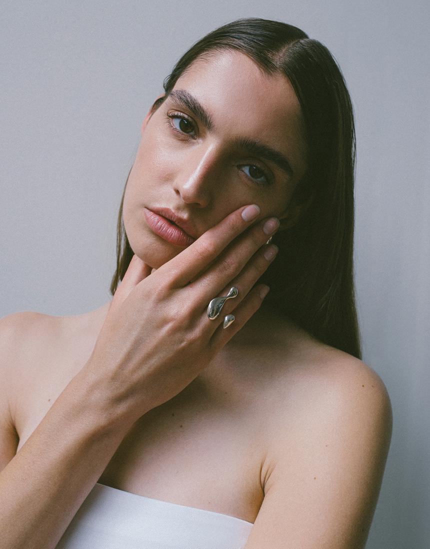 Silver earring on model